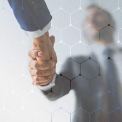 People shaking hands in business agreement background